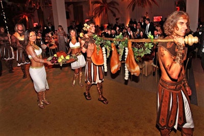 A troupe from Zen Arts processed through the dining room to announce a feast hosted by Mark Antony and Cleopatra, also known as dinner at the California Science Center's 'Discovery Ball.'