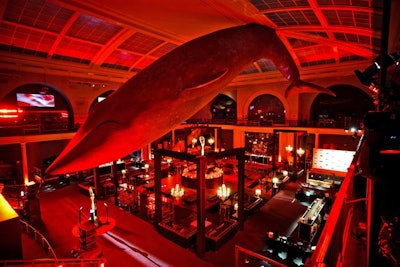 In a bid to give the after-party space in the Milstein Hall of Ocean Life a different look, Stoelt Productions washed the room in red lighting and added black furnishings.