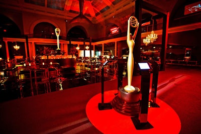 A second oversize trophy was placed away from the main floor and anchored on a circular red carpet. The piece was surrounded by four iPads, where attendees could view the work of the winners.