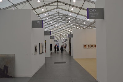 In lieu of large HVAC units that would detract from the tent's clean lines, the air conditioning units were installed beneath the fair's plywood flooring. The air was pumped out via 72 (12 per section) large air ducts that kept guests, the tent, and the art cool.