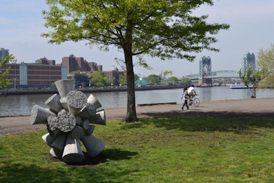 To take advantage of its park setting and water views, the organizers erected a sculpture park along the length of the fair's west side. The outdoor exhibit gave guests the opportunity to peruse a series of specially commissioned artworks that dotted the landscape, including James Angus's 'Concrete Cloudburst (2012)' (pictured), with the Robert F. Kennedy Bridge serving as the backdrop.
