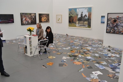 In addition to furnishing their own exhibition space, each gallery participated in a contest where the winner of the most innovative use of space received a $10,000 prize from the Frieze art-star jury. The Galleria Raffaella Cortese space featured artist Marcello Maloberti's installation of mountain-landscape tear sheets on the floor.