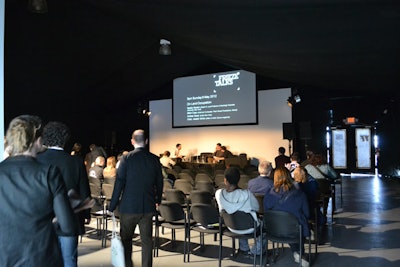 Located to the east side of the venue was a small auditorium that housed special presentations and group talks throughout the weekend. The intimate space, built beyond the confines of the main exhibition halls, measured 30 by 30 feet and accommodated seating for 100 people.