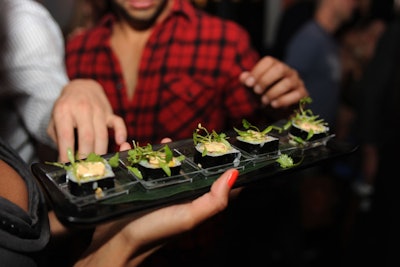 Guests sampled new menu items, which included cubed watermelon salad, calamari fries with guava dipping sauce, shrimp and grits ceviche spoons, and spider sushi rolls.