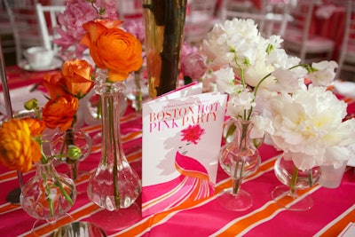 Peonies, Evelyn Lauder's favorite flower, decorated tables along with orange roses. Winston Flowers provided the springy arrangements. Mario Avila Design created the program.
