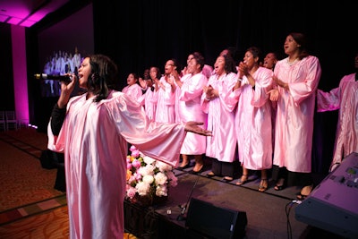 A gospel choir wore pink robes and belted out songs such as 'Ain't No Mountain High Enough.'