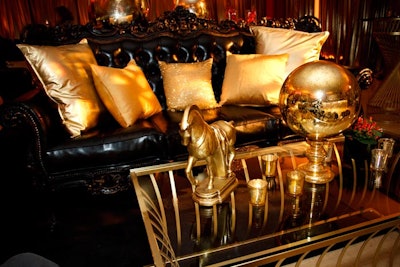 Pillows spruced up the tufted couches, and coffee tables held curiosities such as a golden globe and horse statue.