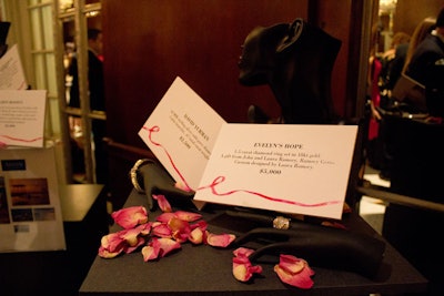 Auction items, which were displayed in the reception space, included a three-night stay at Loews Miami Beach hotel, a Chanel 'mademoiselle' handbag, and a gold and diamond ring designed by Laura Ramsay and titled 'Evelyn's Hope' (pictured).