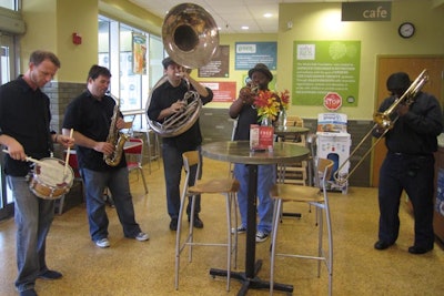 The Grass Roots Band performed in the store on the first day of the weekend-long grand-reopening celebration.