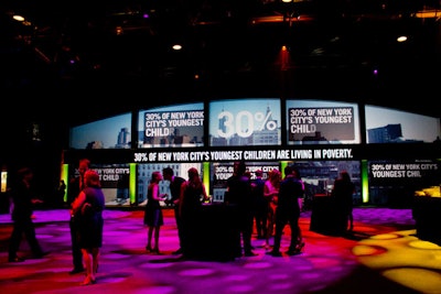 To further illustrate the theme, one side of the cocktail space was shaped into an archway and illuminated with photos from city subway stations as well as projections of poverty statistics.