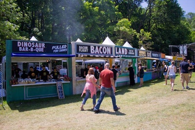 The first Great GoogaMooga brought out 75 of New York's restaurants to serve some of their most popular dishes. Among the lengthy list of participating eateries were Dinosaur Bar-B-Que, Big Gay Ice Cream, and Colicchio & Sons, each situated in different colored booths. Festival attendees paid for their bites by the dish.