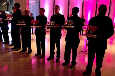 During the post-show reception, waitstaff lined up to serve cocktails, including prosecco and sparkling strawberry bellinis, a nod to the red and white color scheme.