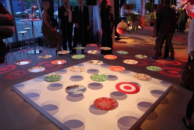 An artsy exhibit suspended project partner Privet House's plates (including one that cheekily featured a bullseye) from rigging points in the ceiling. The result looked as though the 25 pieces of colorful dinnerware were floating in mid air.