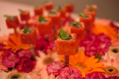 Truffleberry Market prepared bright, seasonal bites. Items included cubes of chilled watermelon with blackberry syrup, fresh mint, and Parmesan cheese.