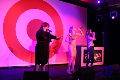 Wilson Phillips, which has gained a healthy second wave of popularity thanks to hit movie Bridesmaids, took to the custom 16- by 24-foot stage toward the evening's end. The surprise performers sang 'Happy Birthday' to Target before delivering a set that included 'Hold On.'
