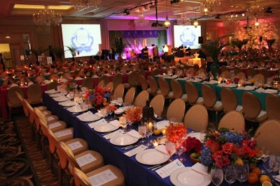 Drop-down screens at the front of the ballroom were used throughout the evening, first to showcase photos relating to each live-auction lot and later to broadcast a live interview via Google video hangout with graduates of the educational outreach programs. The screens also showed slides of past and present woman's board members dating back to the 1900s.