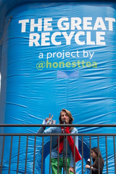 In addition to dropping cans and bottles into the 'Great Bin,' participants in Honest Tea's promotion could receive points by pledging to recycle more often from a microphone set up on a stage.