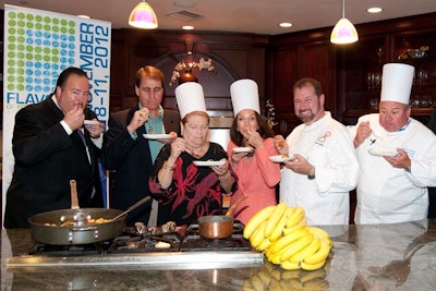 Flavors of Fort Lauderdale organizers and supporters sample Bananas Foster Flambé at the festival's launch Tuesday at Hugh's Catering.