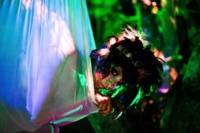 A Lucent Dossier performer emerged from a pod decor piece.