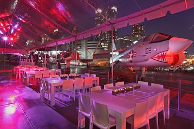 Following the three separate screenings, some 2,500 guests headed to the Intrepid, where the producers had created an environment on the museum's flight deck using mostly white furnishings and carpet. As a result of the week's erratic weather, the production team used clear tents to cover a large portion of the 900-foot-long space.