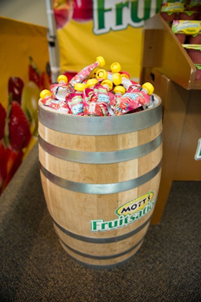 At the event, organizers presented the new applesauce product in barrels marked with brand's logo.