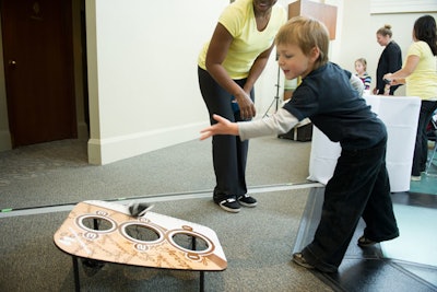 Kids tried their hands at a beanbag toss.