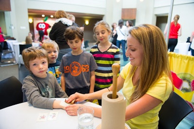 Children lined up for temporary tattoos at the Mott's Fruitsations product launch.