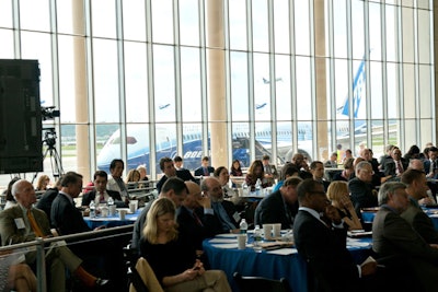 The daylong summit met at Ronald Reagan National Airport, with the Dreamliner in the background.