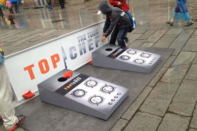 Country-fair-inspired games included a custom corn hole toss, which had a board made to look like the top of a stove.
