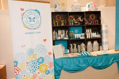 The Honest Company had a large display area with several tables organized with full-size products as well as samples.