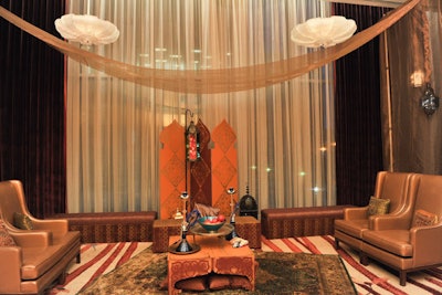 The reception area in the grand foyer of the Ritz resembled a hookah lounge, with tapestry rugs and gold furniture.