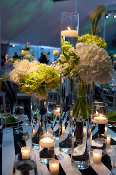 Black-and-white linens from Private Label topped the dinner tables. Event Creative's floating candles and springy flower arrangements rounded out the tabletop decor.