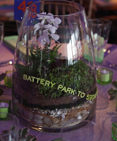 Terrariums filled with plants and grasses native to the park decorated some tables.