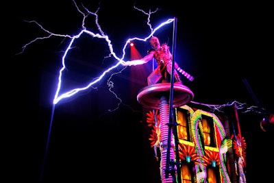 An entertainer known as Skyfire performed on an elevated 17- by 40-foot truss frame using electrical currents generated from a 15-foot tesla coil.