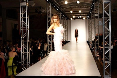 From their seats in the Currelly Gallery, V.I.P.s watched the Play With Barbie fashion show, where 25 T.F.I. designers created looks inspired by Mattel's iconic doll. On display in the Crystal, Barbie dolls wore miniature versions of the runway looks.
