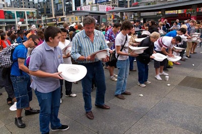 In Dundas Square, visitors looked eagerly into one of 200 white cowboy hats for the winning red envelope, which would give them a chance to experience the Calgary Stampede's centennial.