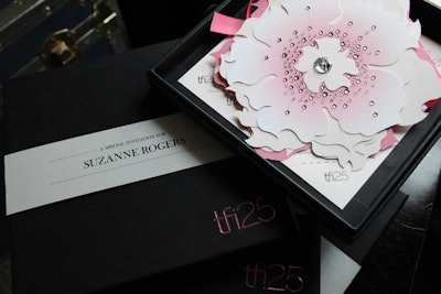Palettera Custom Correspondences created eye-catching invitations, studded with Swarovski crystals. The flowers pulled apart to reveal the event details.