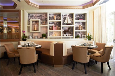 The dining room incorporates a neutral color palette with modern furnishings.