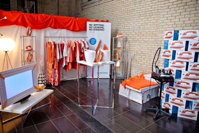 Sponsor activations lined the Crystal. The orange and white Reliable activation was set up like a closet. For a donation to T.F.I., guests could draw a ball from a white bucket. Some lucky guests won a professional-caliber iron.