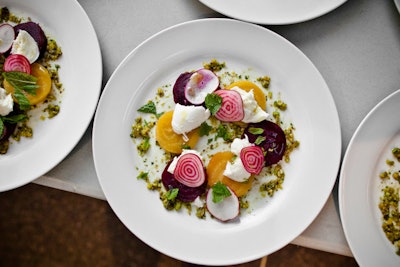 The meal began with a bright beet salad.