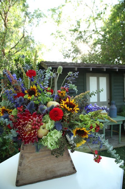 At Barbra Streisand's fund-raiser for the Cedars-Sinai Women's Heart Center in Malibu, colorful floral arrangements in wooden vases played off the outdoor setting.
