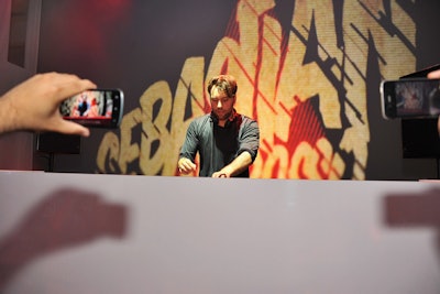 Swedish House Mafia's Sebastian Ingrosso took to the stage in New York, spinning house music in front of animated projections as the audience snapped shots on their smartphones.