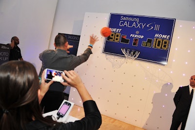 As a way to demonstrate the phone's 'burst shot,' a feature that takes three images a second, guests could throw a basketball while a staffer took photos. The photos were then printed out as a take-home item.