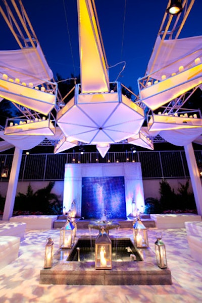 A 23-foot custom-built starburst lantern lit by candles served as the focal point of the atrium.