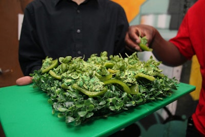 As a playful way to add to the visuals, Sublime Catering worked with Kim Graham Associates to create vibrantly coloured event menu. Dishes included a chicken salad with green peas and pesto, served in a green pepper cup.