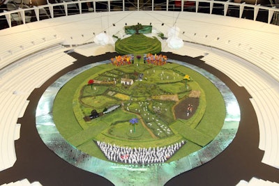 Danny Boyle, the artistic director of the London 2012 Olympic Games opening ceremony and the director of Oscar-winning film Slumdog Millionaire, revealed a model of his design for the big event earlier this month. The show on Friday, July 27, will include real farmyard animals on a set modeled after the British countryside.