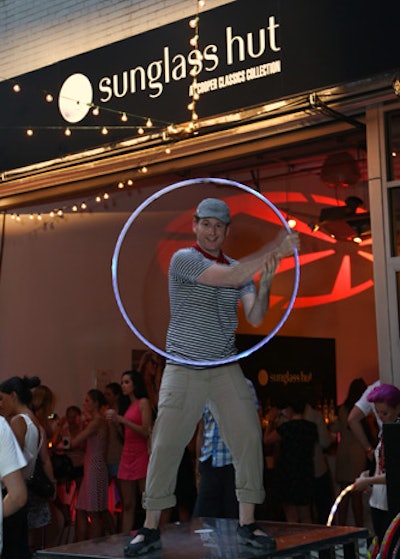 For entertainment, producers brought in a hula-hoop-dancing duo from Groovehoops. The pair took turns dancing to tunes on a platform with LED hoops.