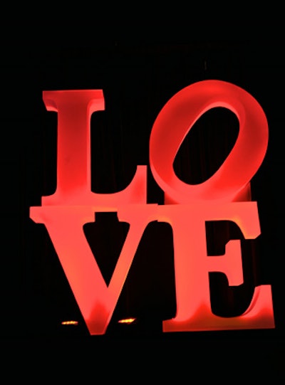 The area's 40-foot bar was backed with a translucent rendition of Robert Indiana's famous 'Love' sculpture.