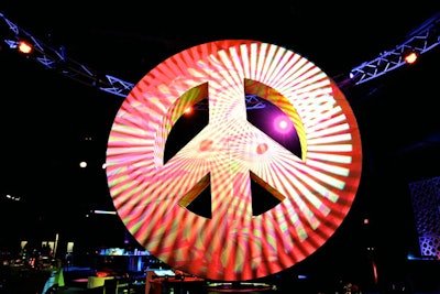 The focal point of the nightclub-inspired space was a 12-foot, 3-D peace sign that rotated slowly throughout the evening.