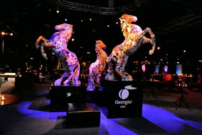 A 200-foot split-rail fence lead to an area dubbed 'Rough Luxe Circa 2012.' Inspired by the lifestyle of a modern-day rancher, the area had a sculpture of battling wild stallions as its focal point. The dramatic pieces were 14 feet tall and had bases embossed with sponsor Georgia Bio's logo.